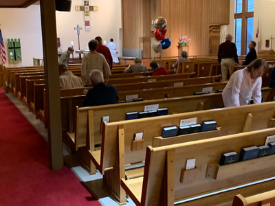 People setting up for service